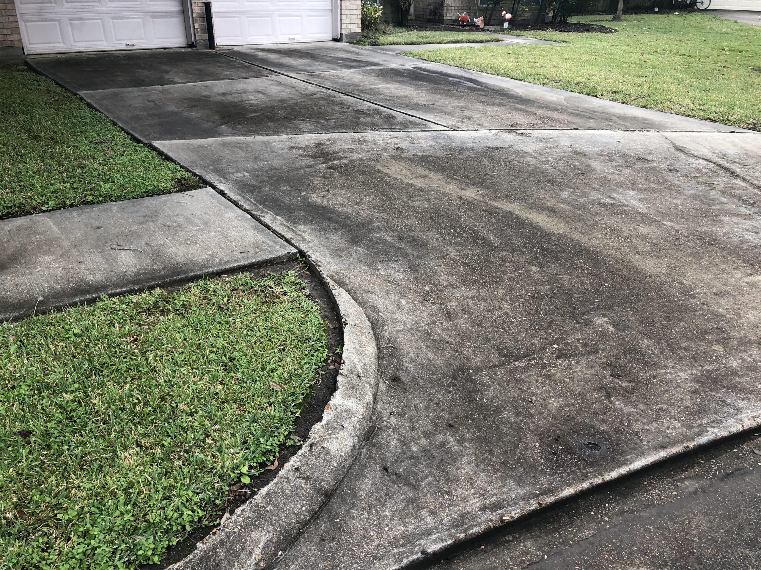 Dirty driveway before power washing